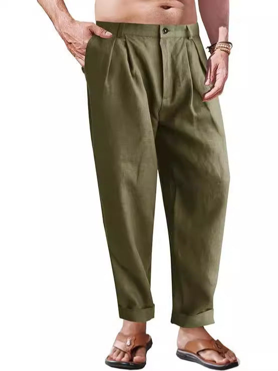 Person wearing olive green pants on a white background