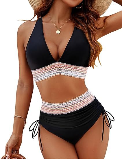 Woman wearing a black and white striped bikini with a straw hat on a white background
