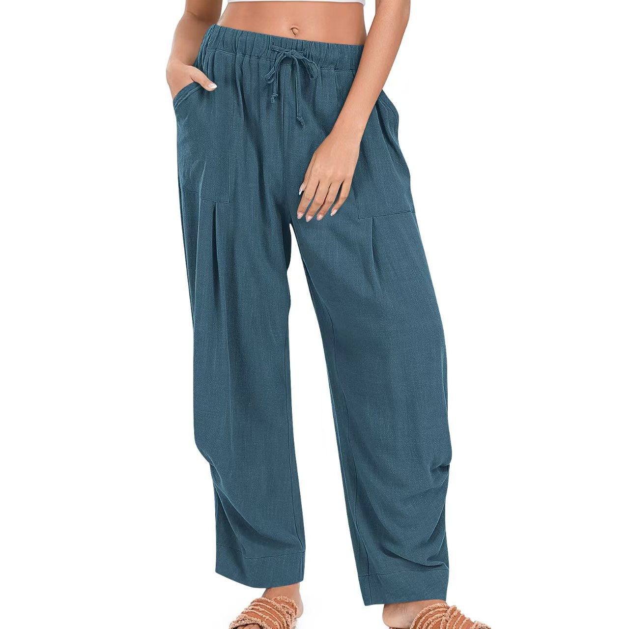 Blue pants worn by a person on a white background