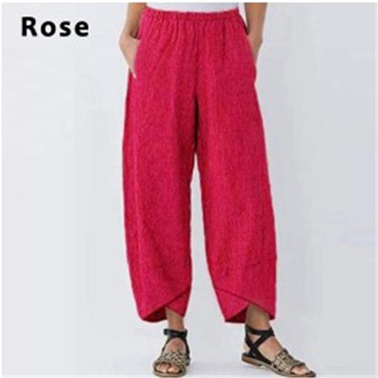 Rose-colored wide-leg pants on a white background