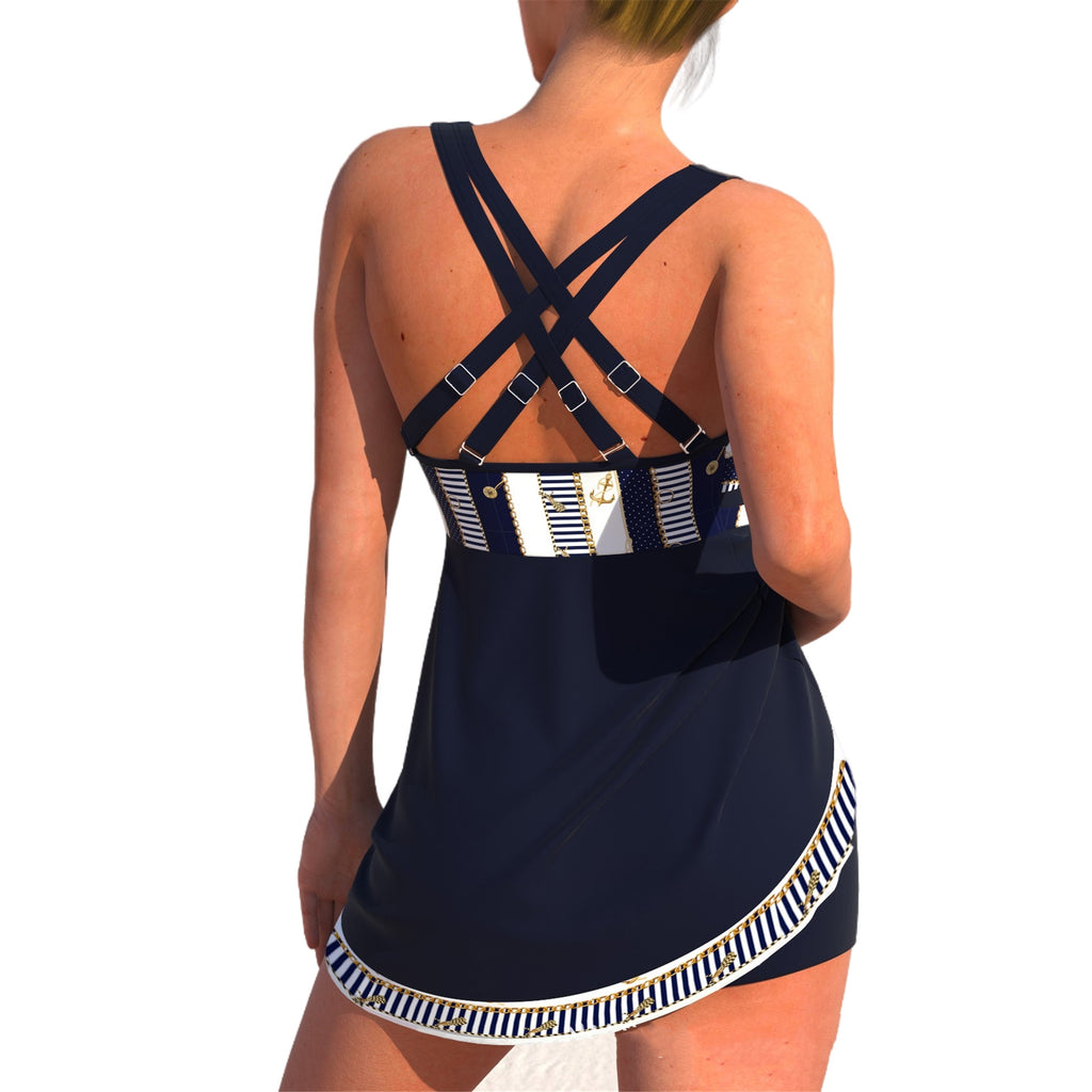 Navy blue dress with criss-cross straps and white trim on a white background