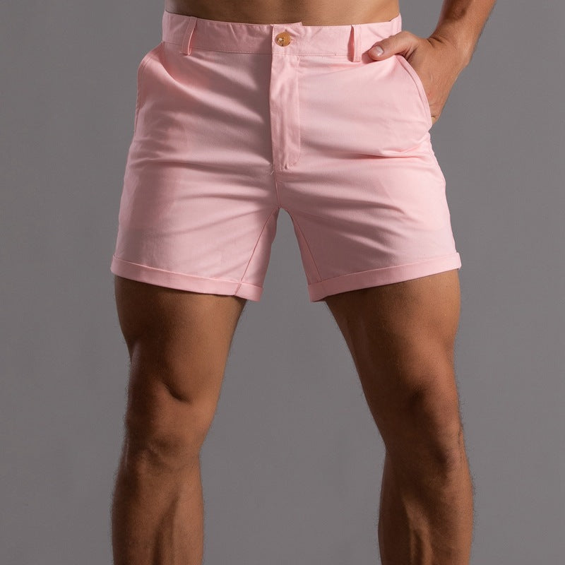Person wearing pink shorts on a gray background