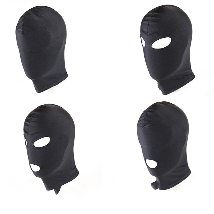 Four black balaclavas with eye holes on a white background