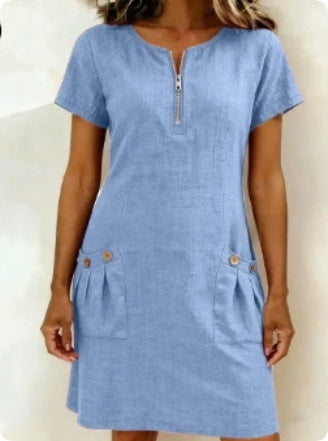 Light blue dress with short sleeves and a zipper on a white background