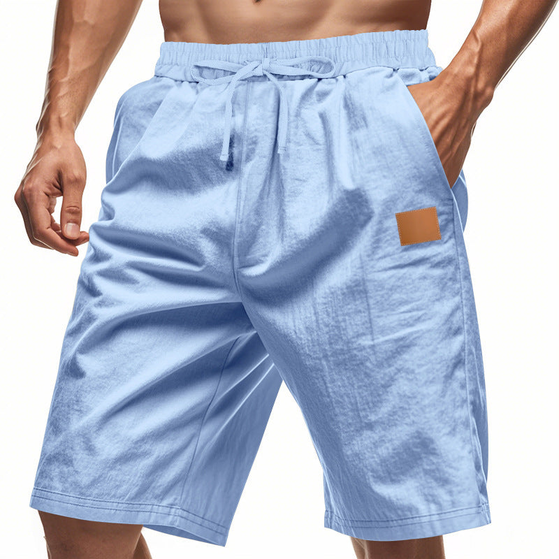 Light blue shorts with a brown patch on a white background