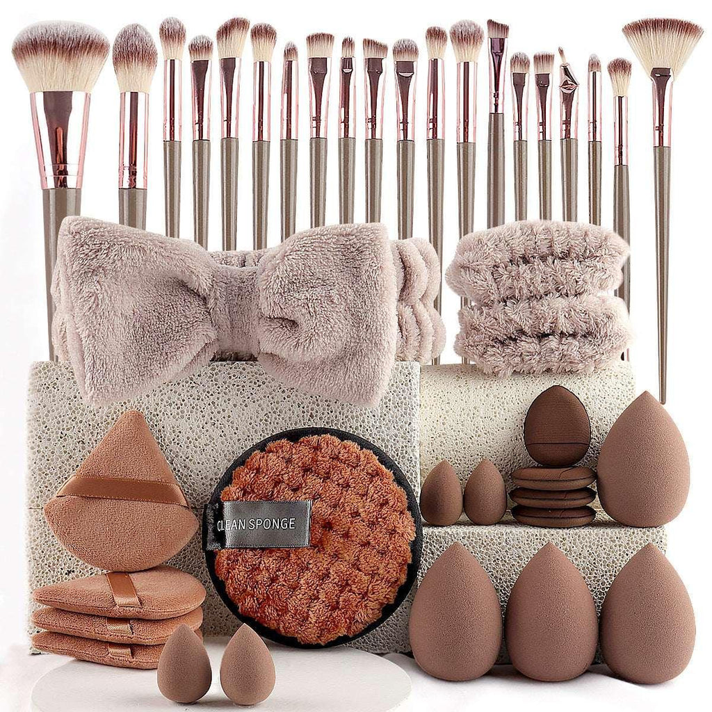 Makeup brush set with beauty sponges, headband, and cleansing pads in neutral tones