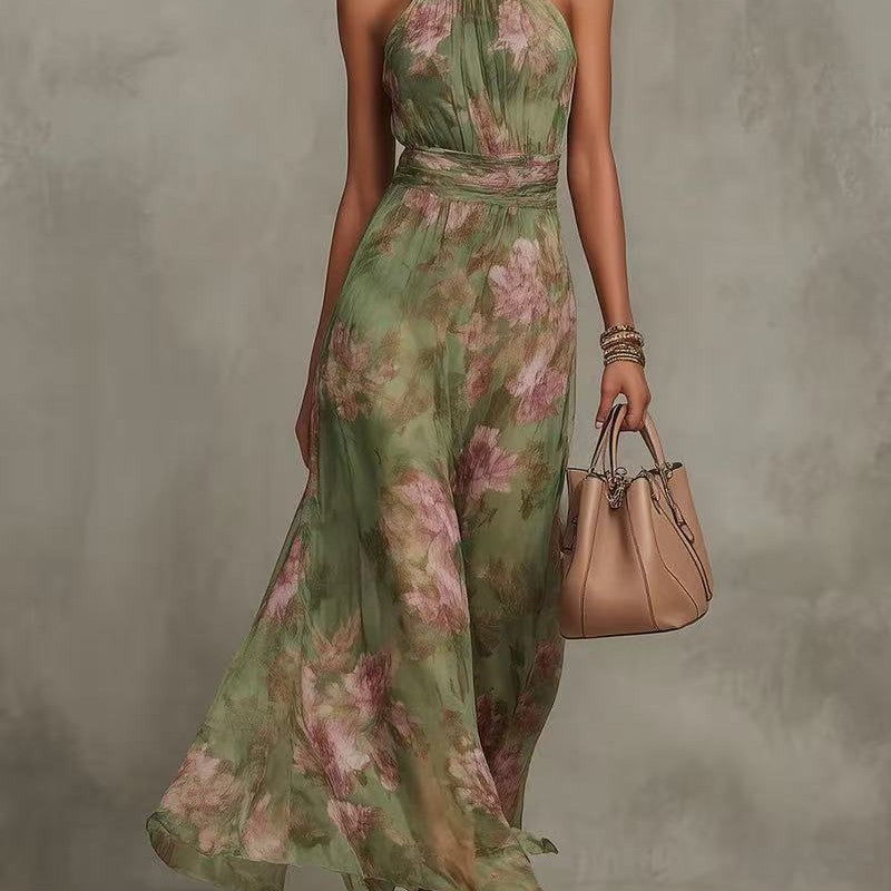 Woman wearing a floral dress holding a beige handbag against a neutral background