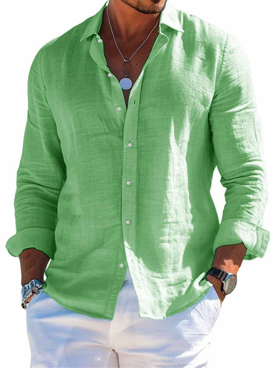 Green linen shirt worn by a person on a white background