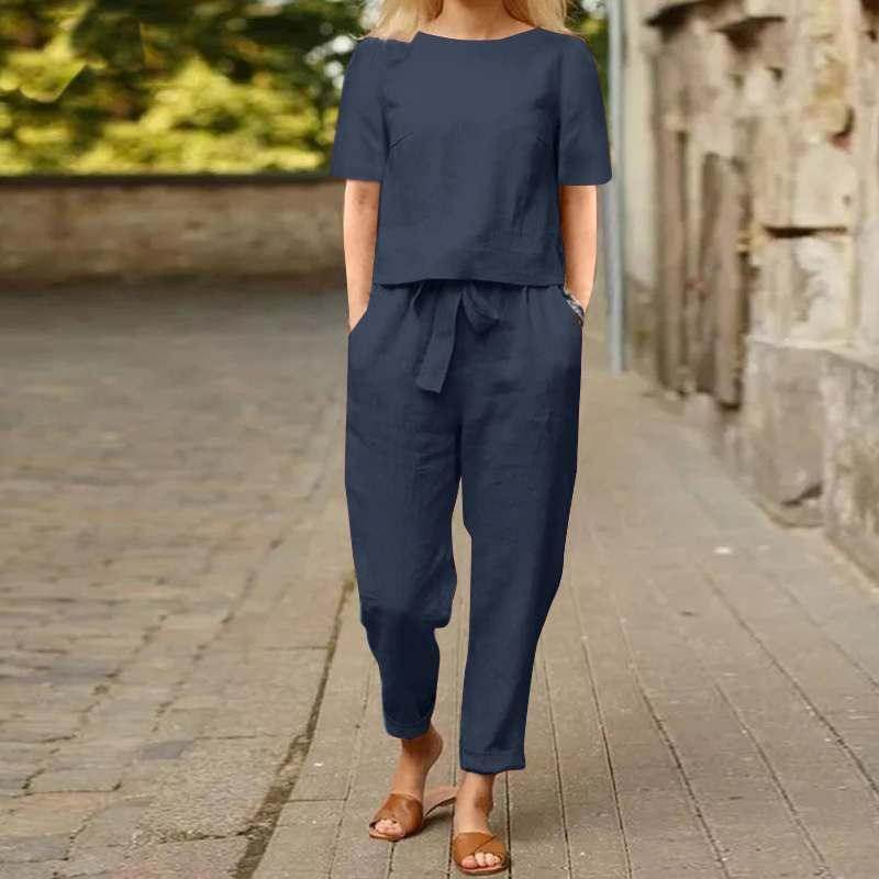 Woman wearing navy blue two-piece linen outfit on outdoor path, ZA-Zola fashion style