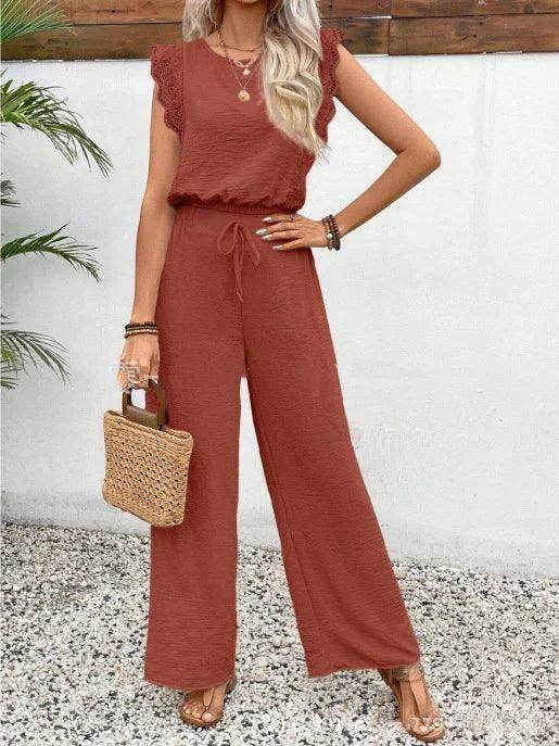 Woman wearing rust jumpsuit and holding woven bag, stylish fashion at ZA-Zola United Kingdom