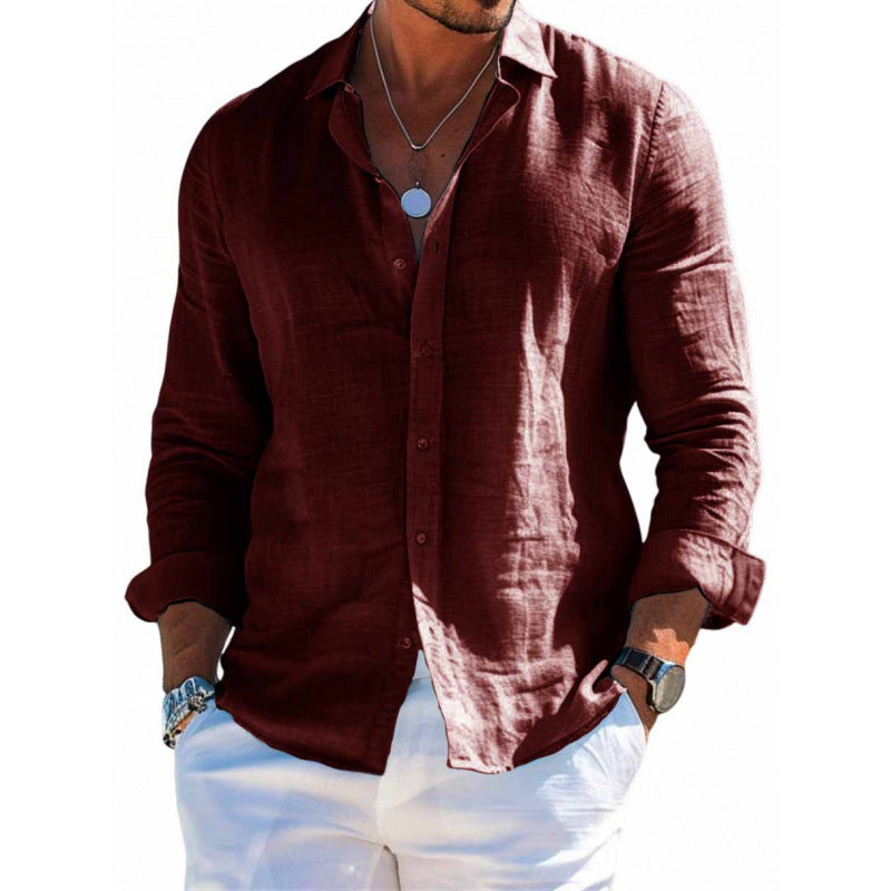 Man wearing a maroon shirt with white pants on a white background