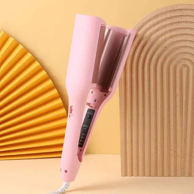 Pink automatic hair curler with digital display on a modern yellow and beige background
