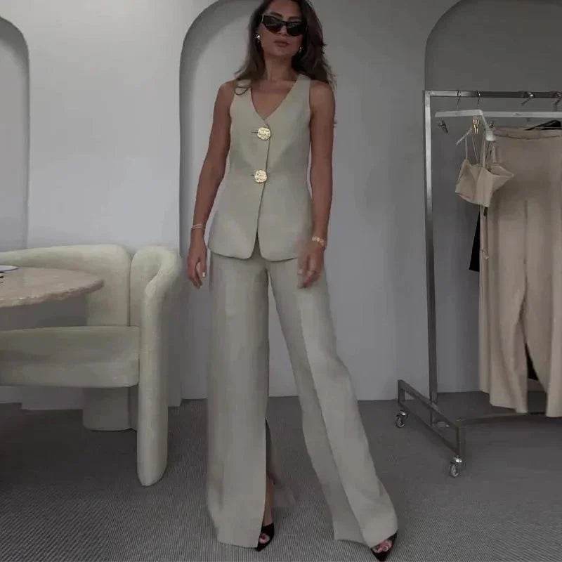 Woman wearing a chic beige pantsuit with gold buttons, ZA-Zola fashion, modern interior