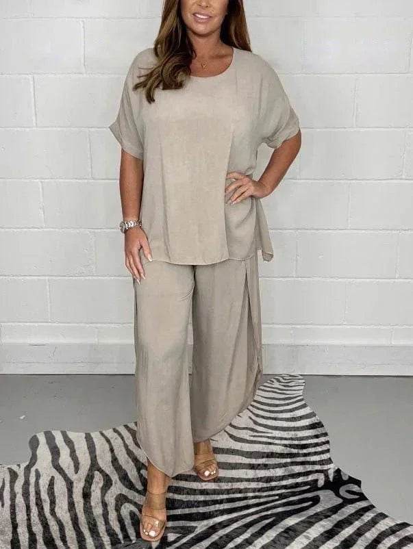 Woman modeling beige loose-fit top and wide-leg pants on zebra-print rug, ZA-Zola fashion