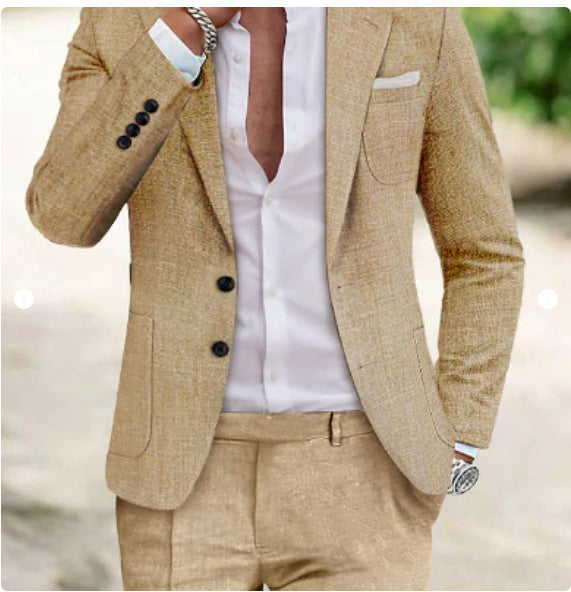 Man wearing a beige blazer and pants with a blurred natural background
