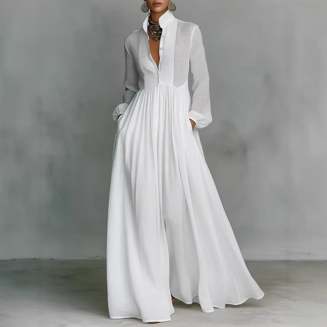 White dress with sheer panels on a gray background