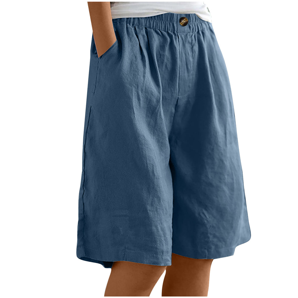 Blue shorts worn by a person on a white background