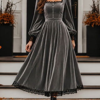 Gray velvet dress with lace details on a staircase