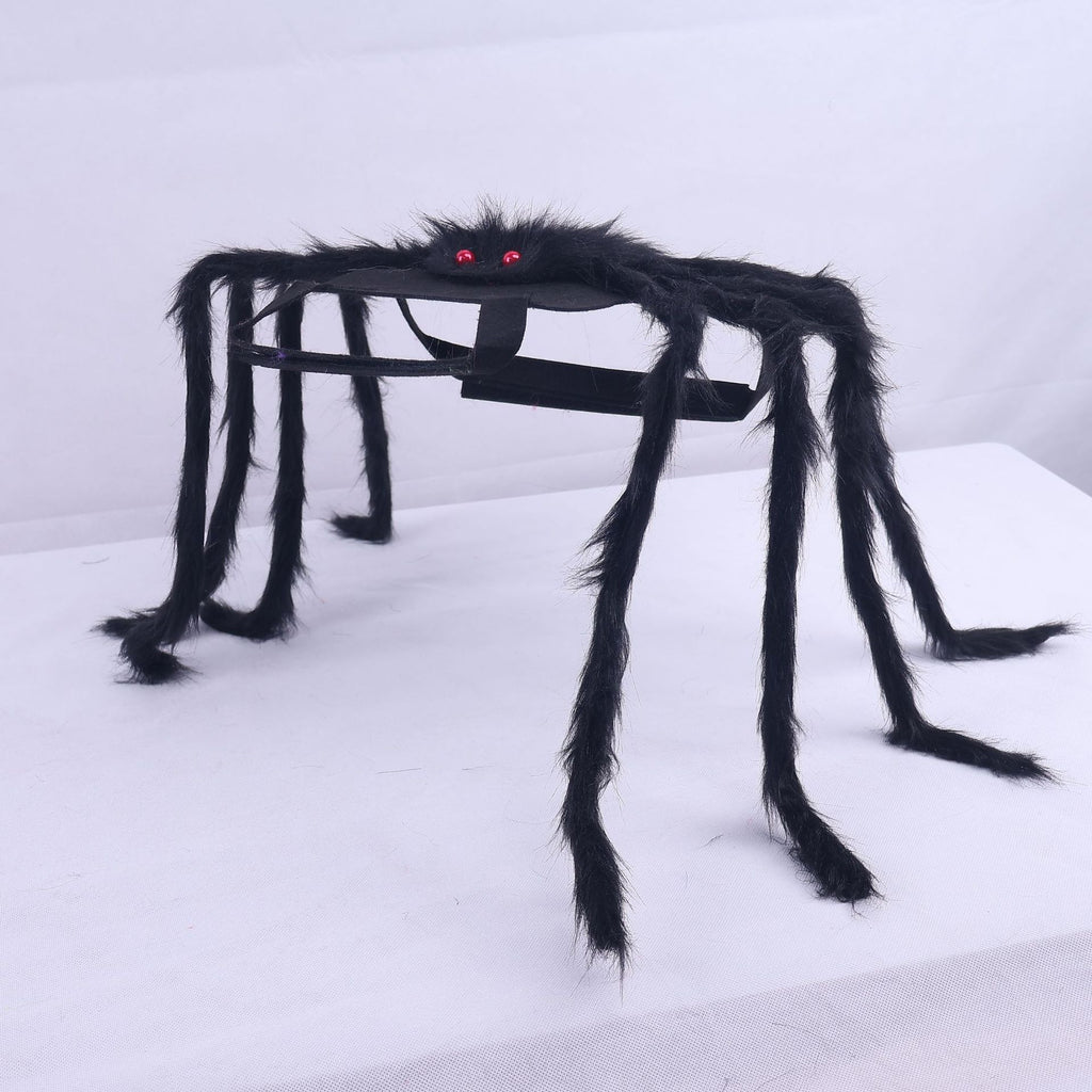 Large black spider decoration with red eyes on a white background
