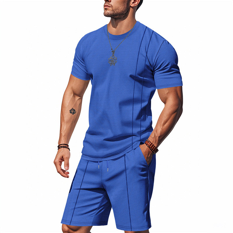 Man wearing a blue athletic outfit on a white background
