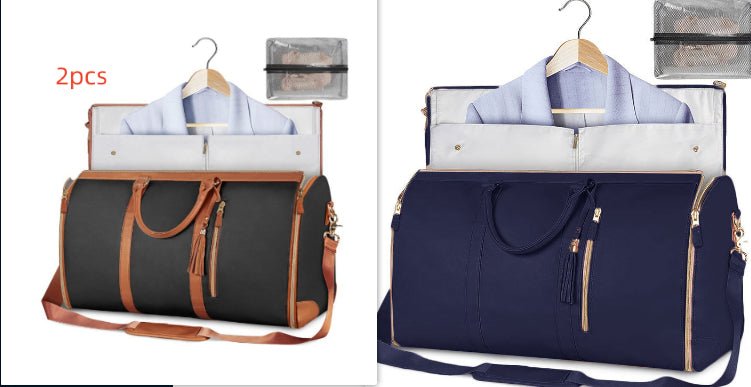 Two travel bags, one black with brown accents and one navy blue, on hangers with shirts inside.