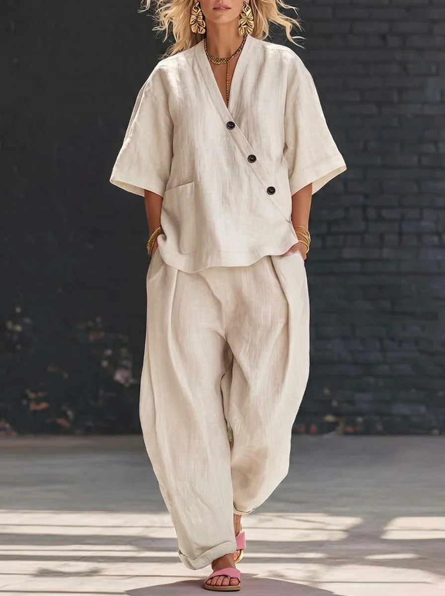 Person wearing a beige outfit with a black background