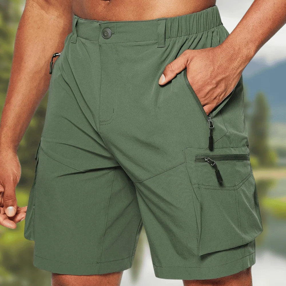 Green shorts with zippers worn by a person outdoors