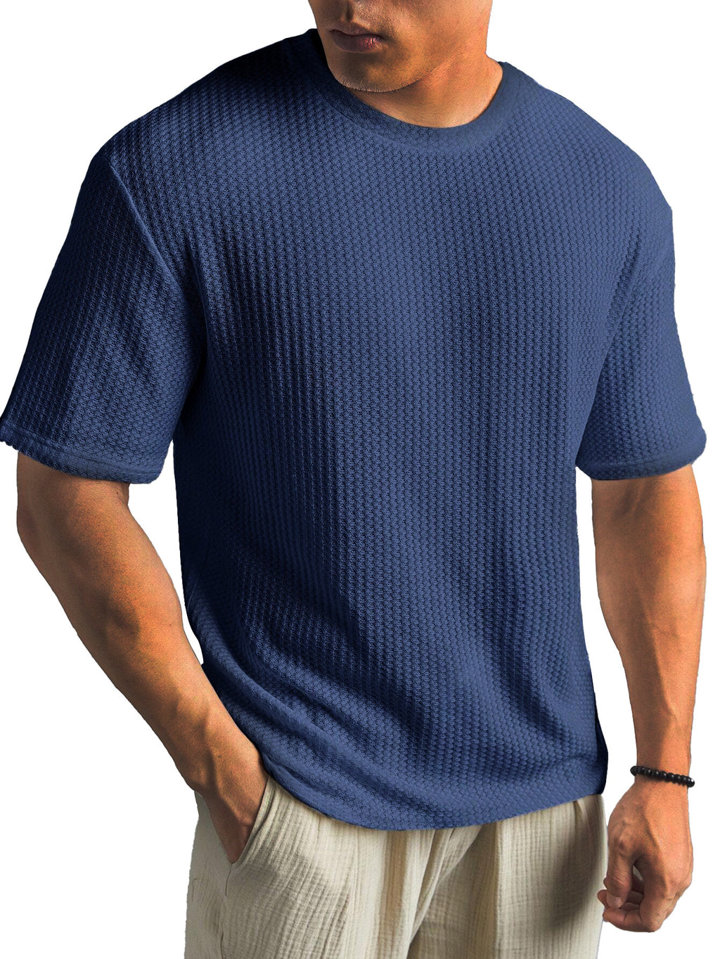 Man wearing a blue textured t-shirt on a white background