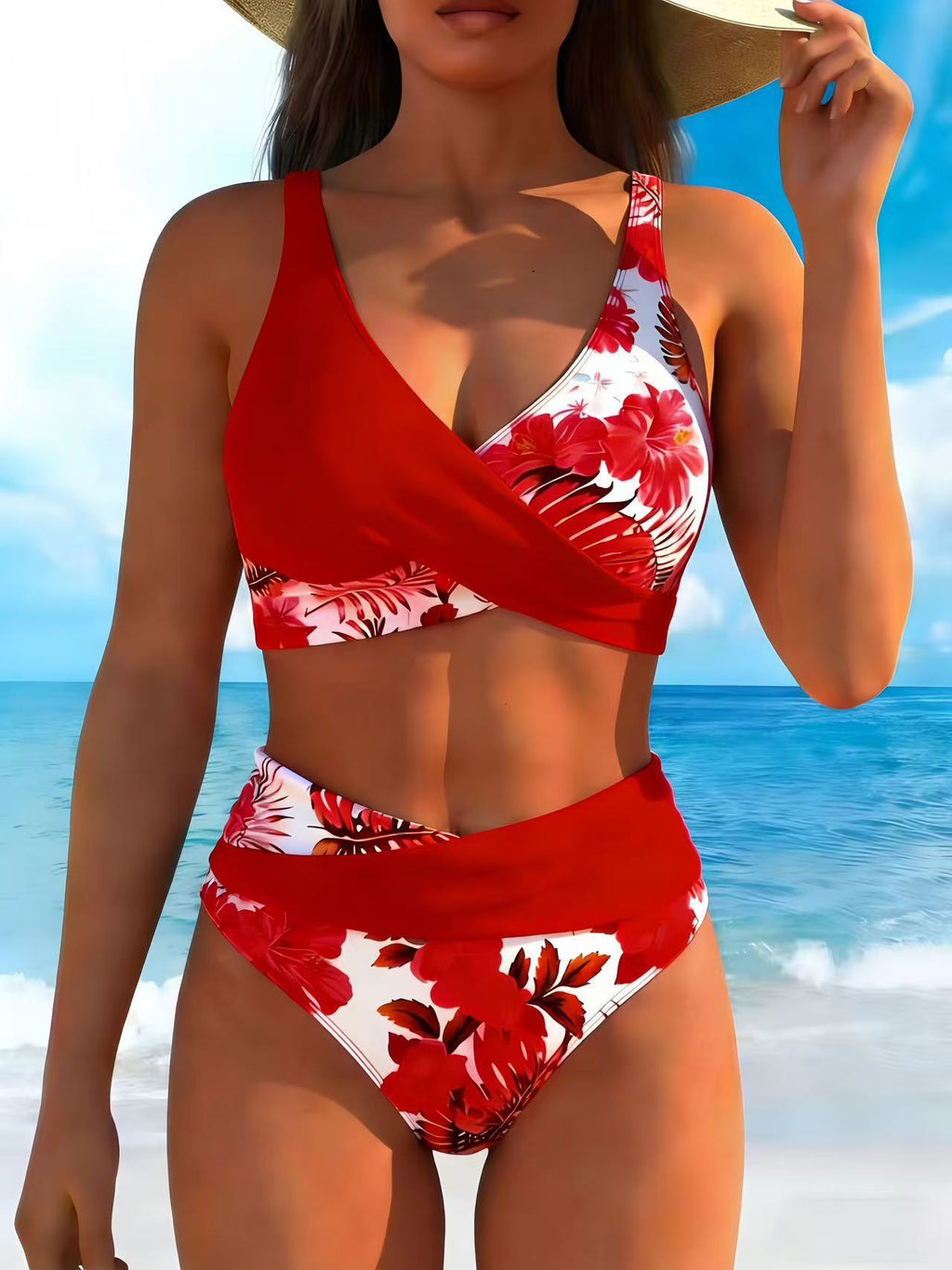 Woman wearing a red floral bikini set on a beach
