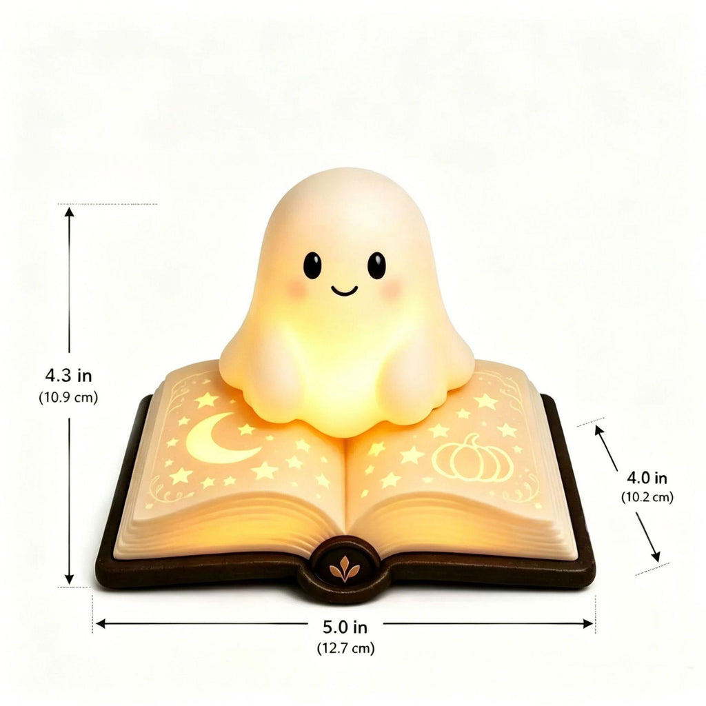 A cute ghost-shaped night light sitting on an open glowing book, shown with dimension arrows and labels indicating height and width on a plain white background.
