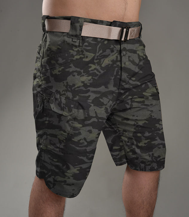 Camouflage shorts worn by a person on a gray background