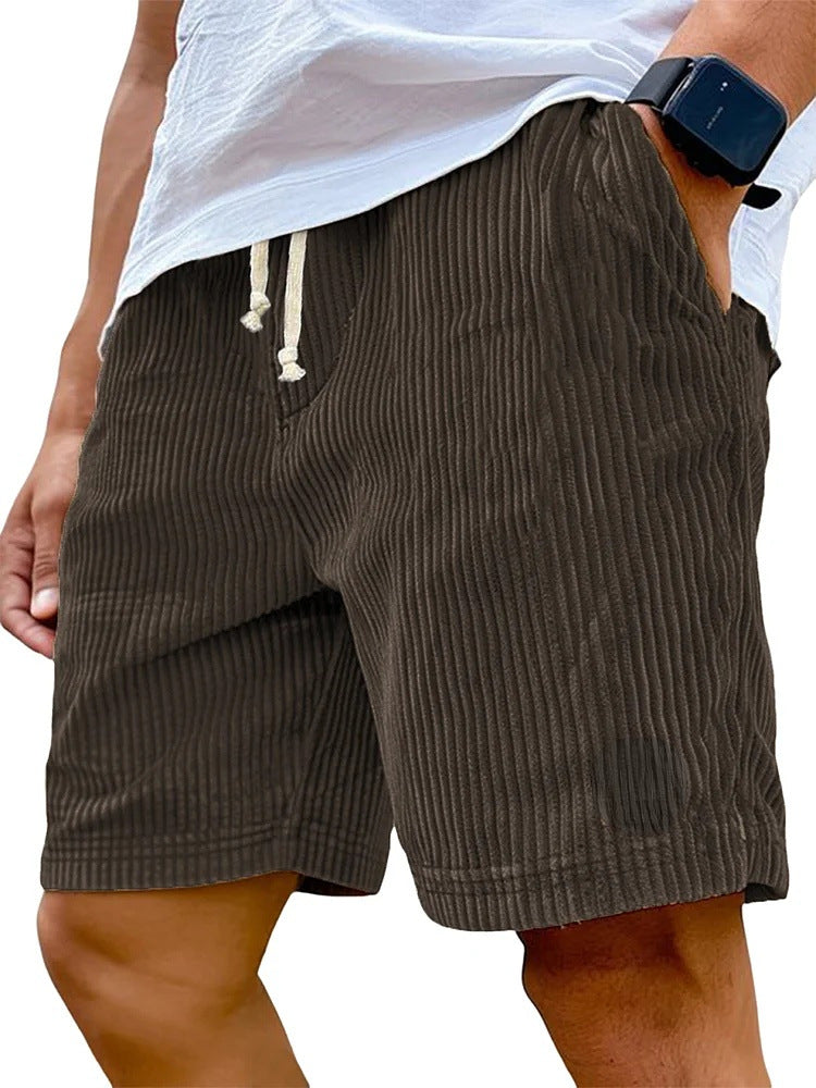 Brown striped shorts worn by a person on a white background