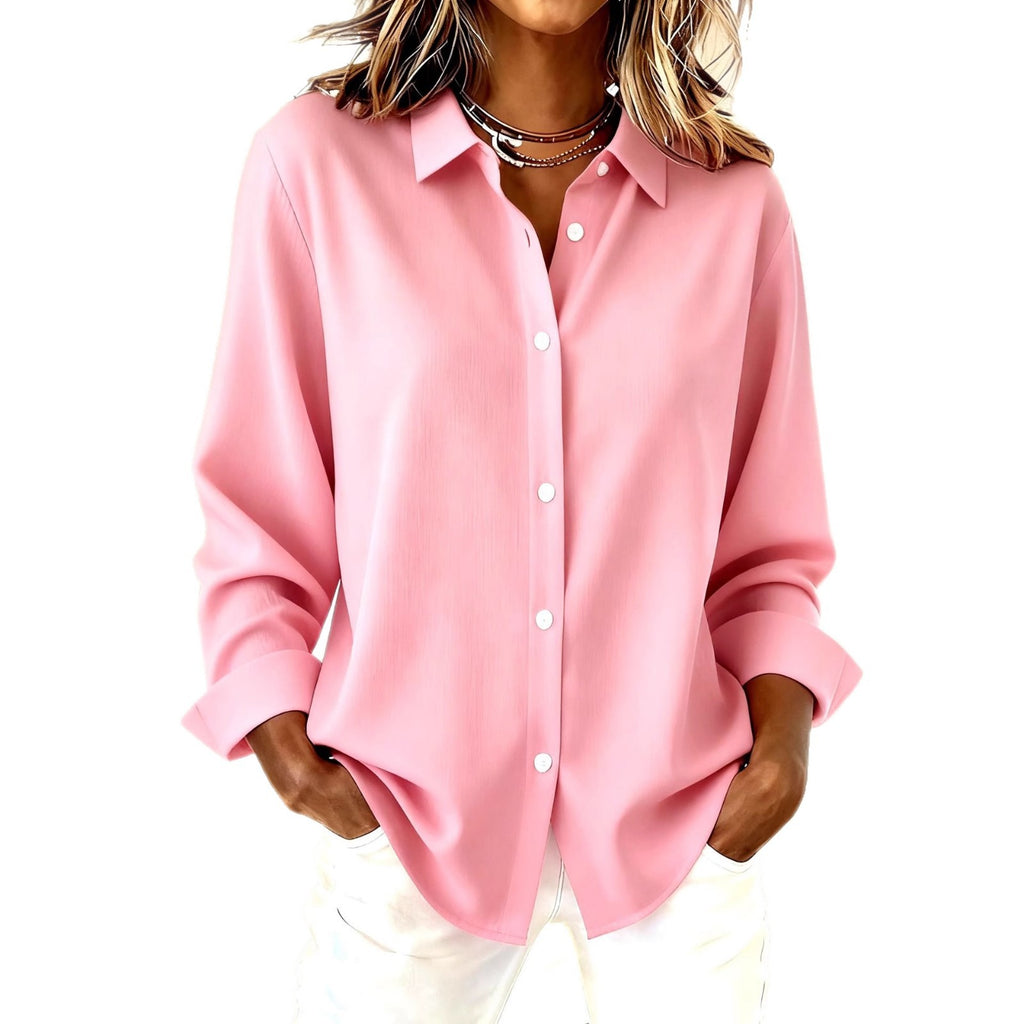 Person wearing a pink button-up shirt on a white background