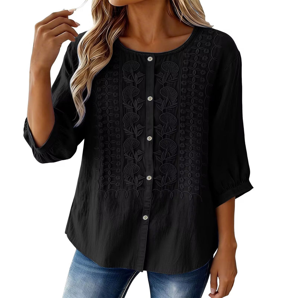 Black lace-up blouse worn by a model on a white background