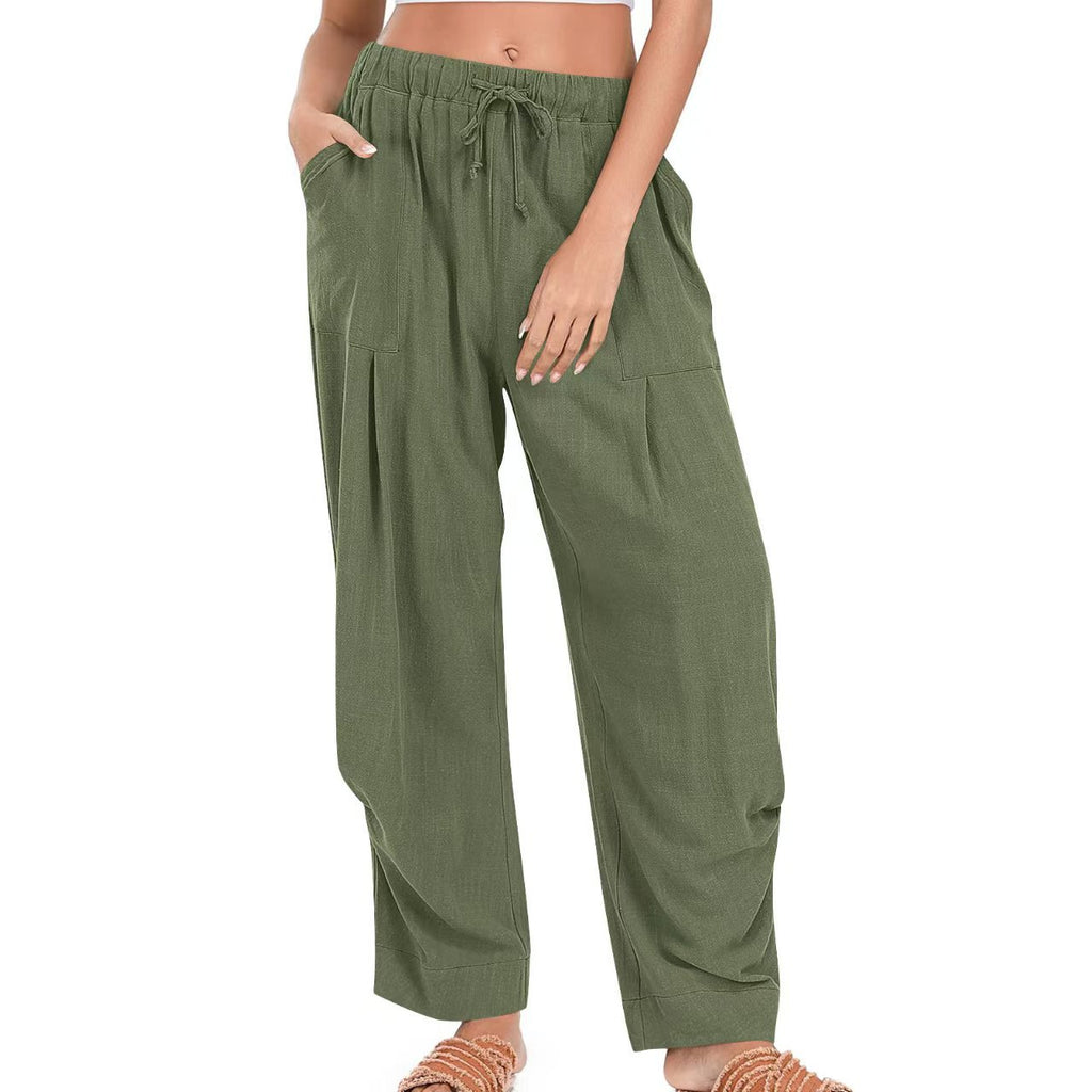 Green wide-leg pants worn by a person on a white background