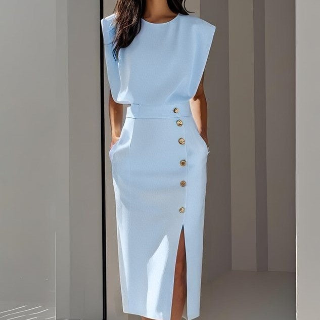 Light blue dress with gold buttons on a neutral background