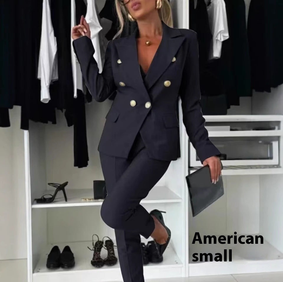 Person wearing a navy blue suit with gold buttons in a clothing store.