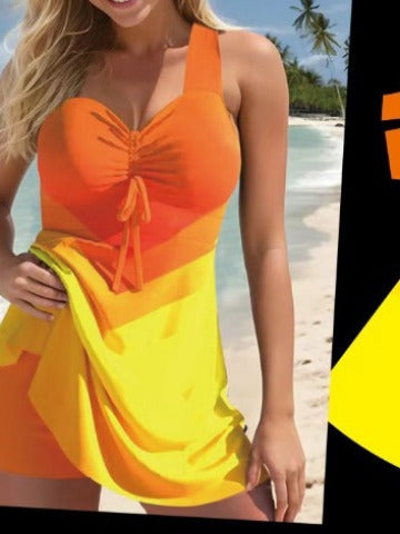 Woman wearing an orange and yellow dress on a beach