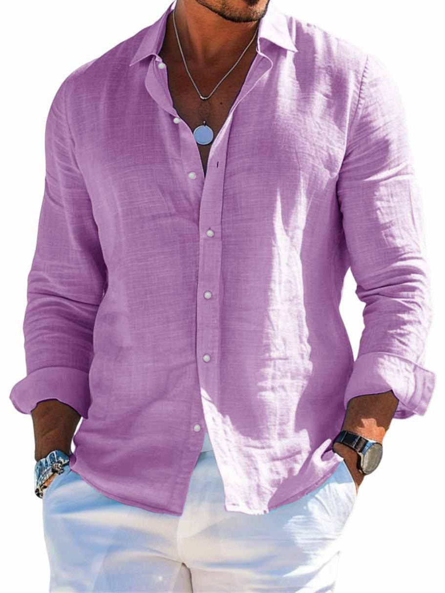 Man wearing a purple button-up shirt with rolled-up sleeves on a white background