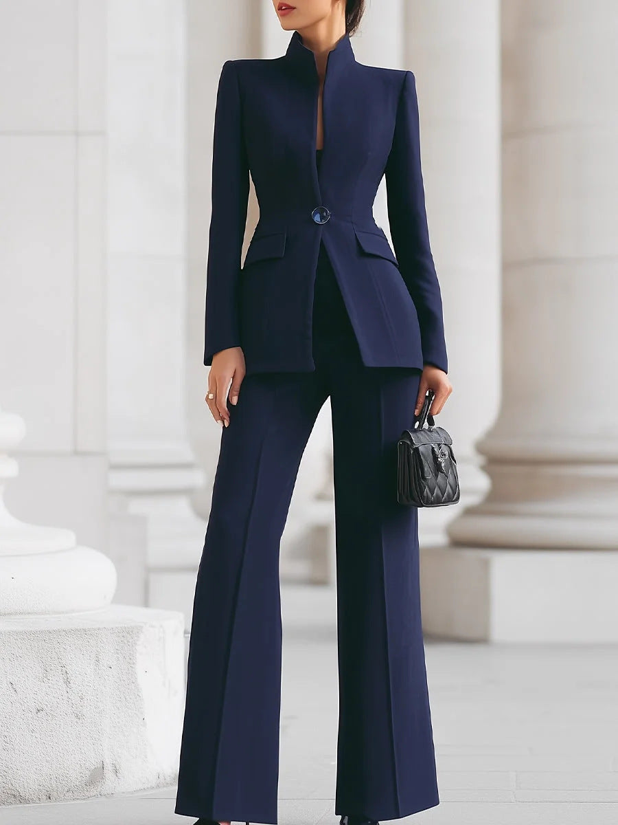 Person wearing a navy blue suit with a white background