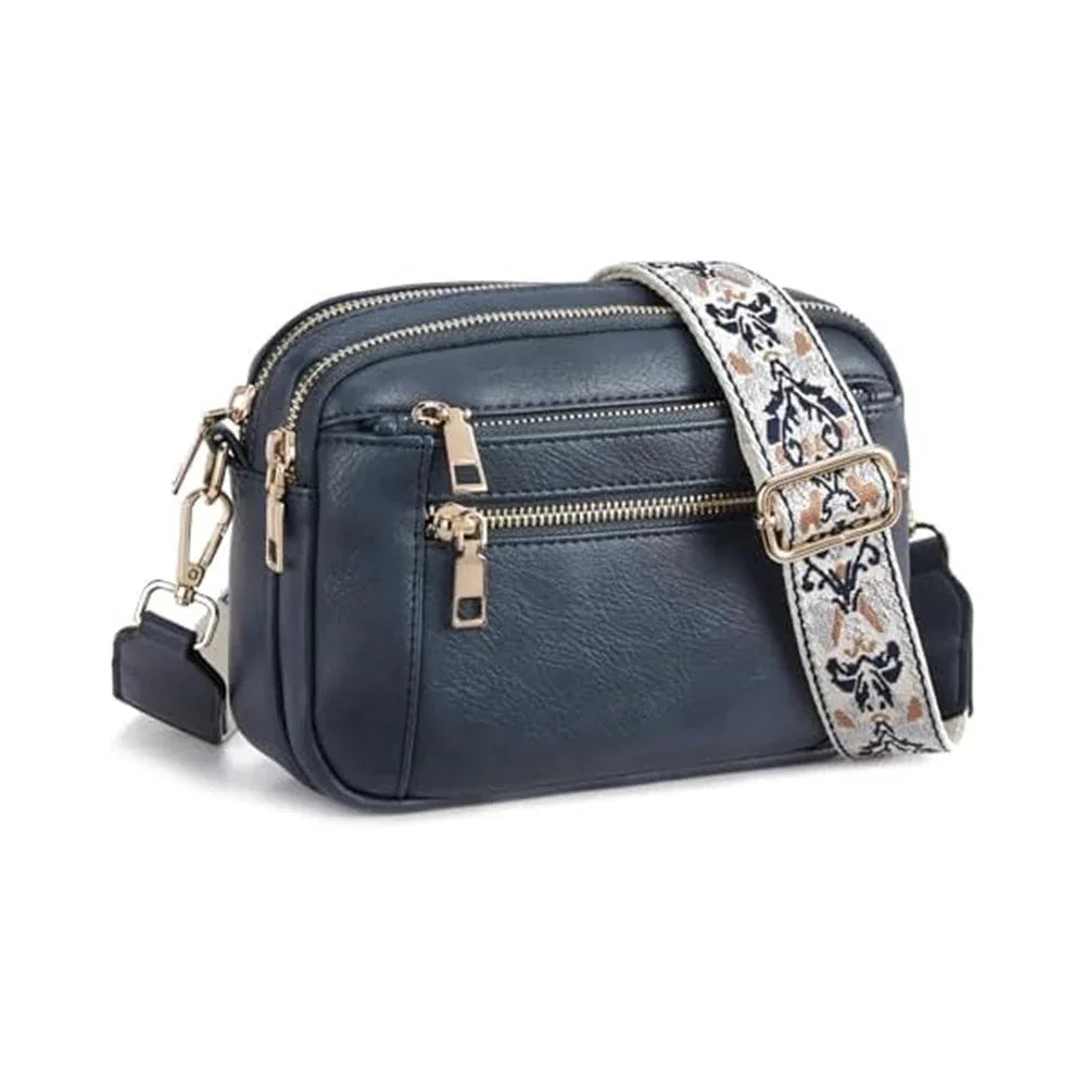 Blue handbag with a floral strap on a white background