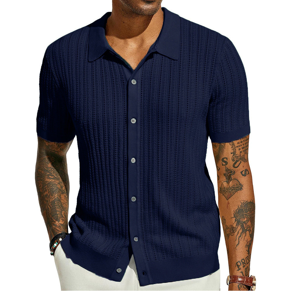 Man wearing a navy blue textured short-sleeve shirt on a white background