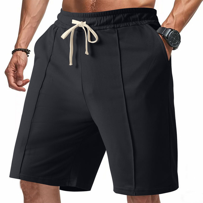 Black shorts with a drawstring on a white background