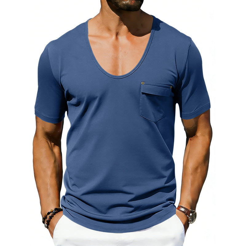 Man wearing a blue t-shirt with a pocket on a white background