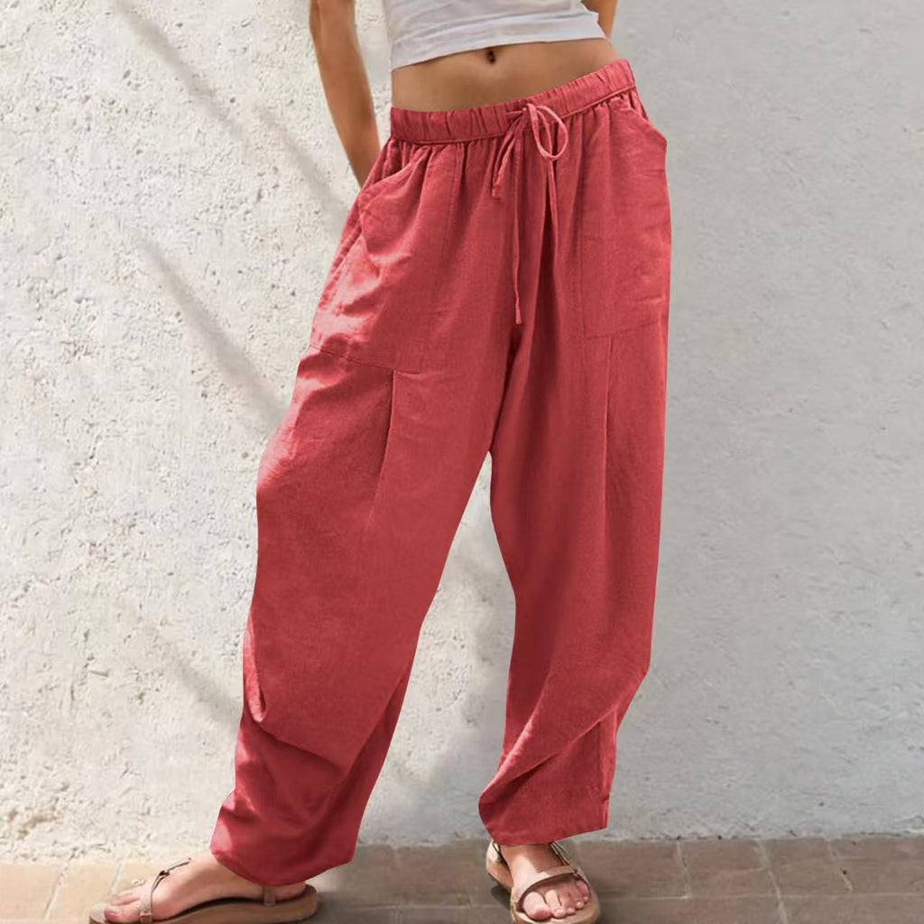 Person wearing red pants with a white background