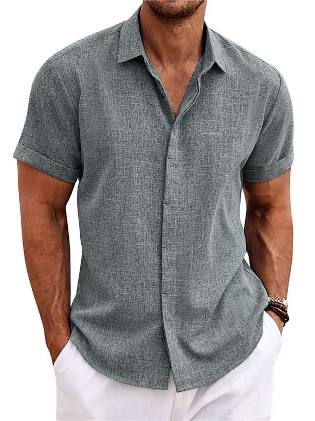 Man wearing a gray short-sleeve button-up shirt with white pants on a white background