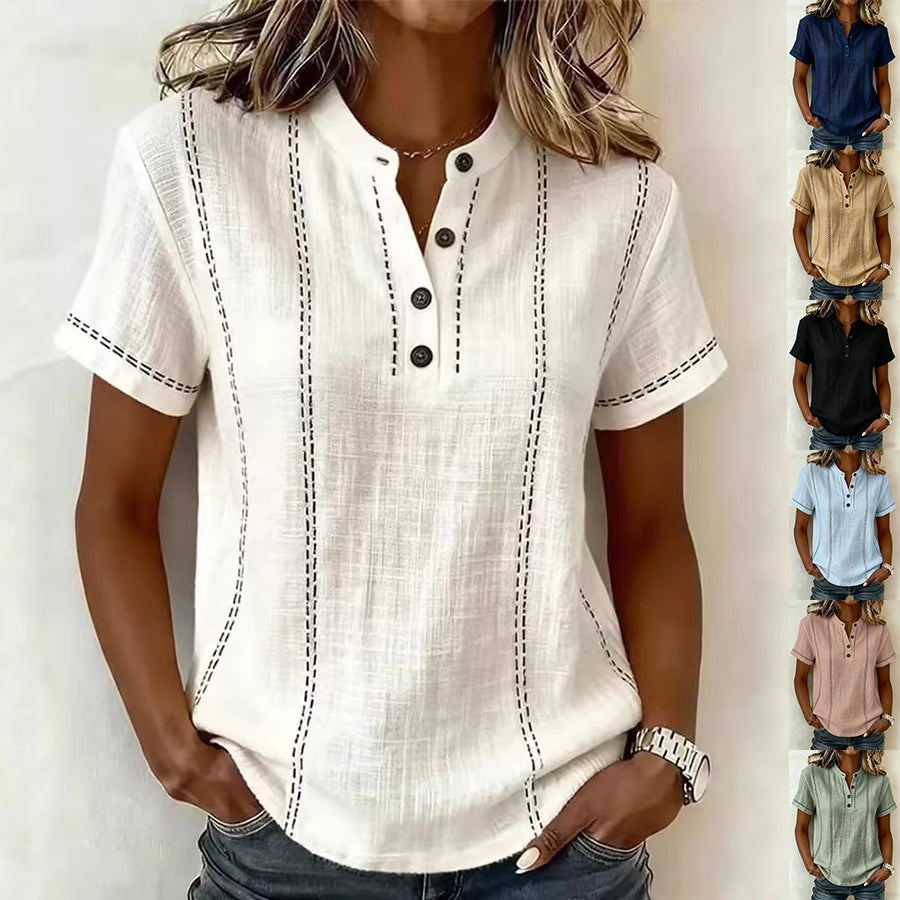 White short-sleeve blouse with black buttons and stitching on a white background