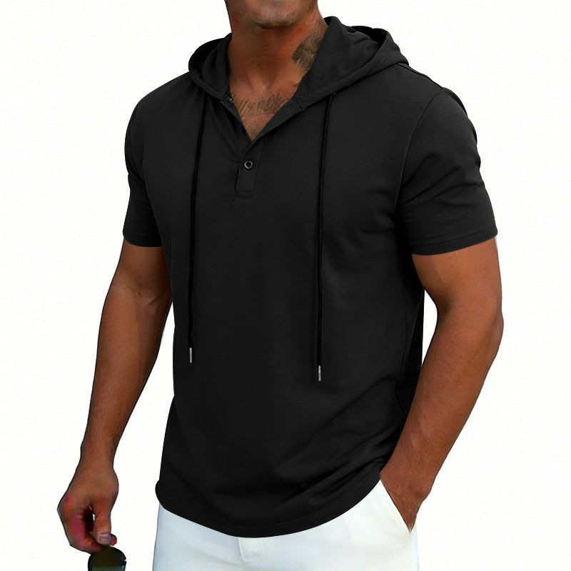 Man wearing a black short-sleeve hoodie on a white background