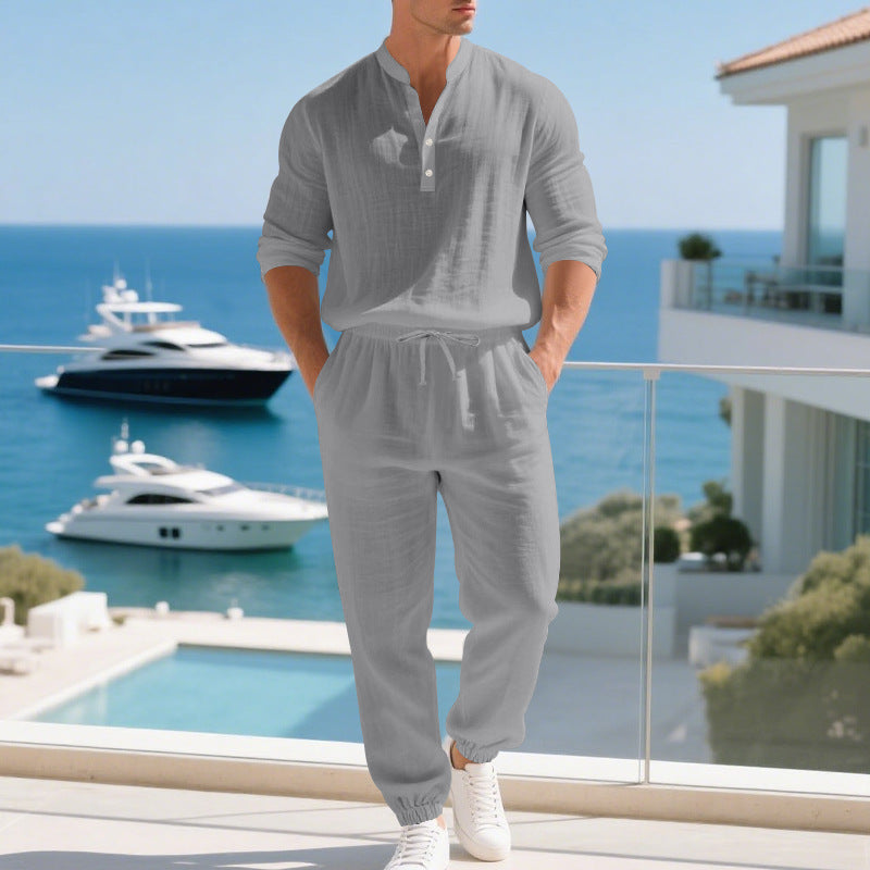 Man wearing a gray loungewear set on a white background