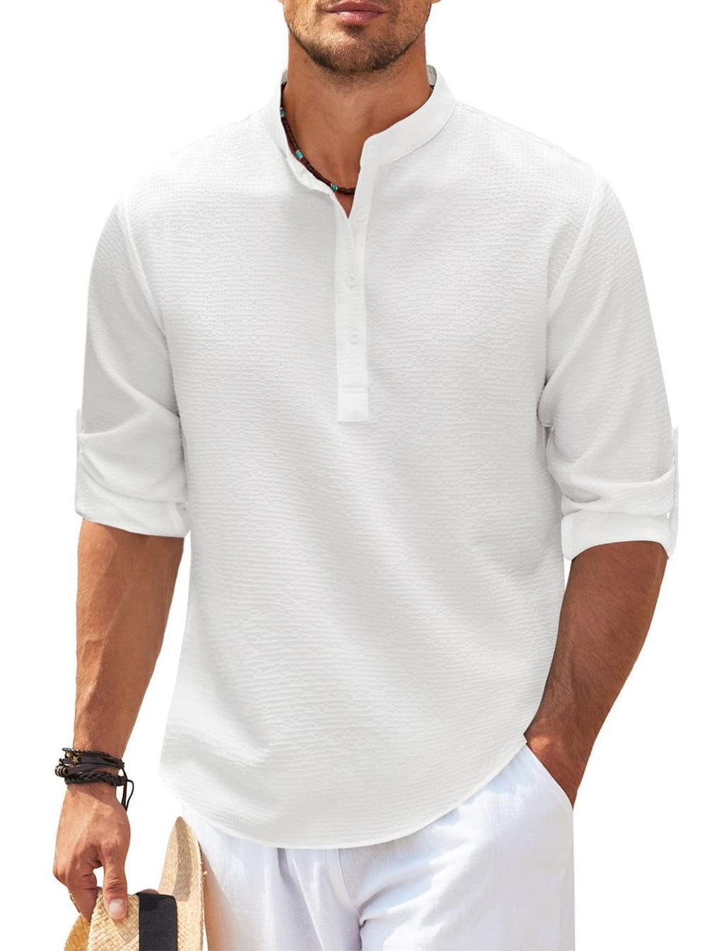 Man wearing a white short-sleeve shirt with a subtle pattern on a white background